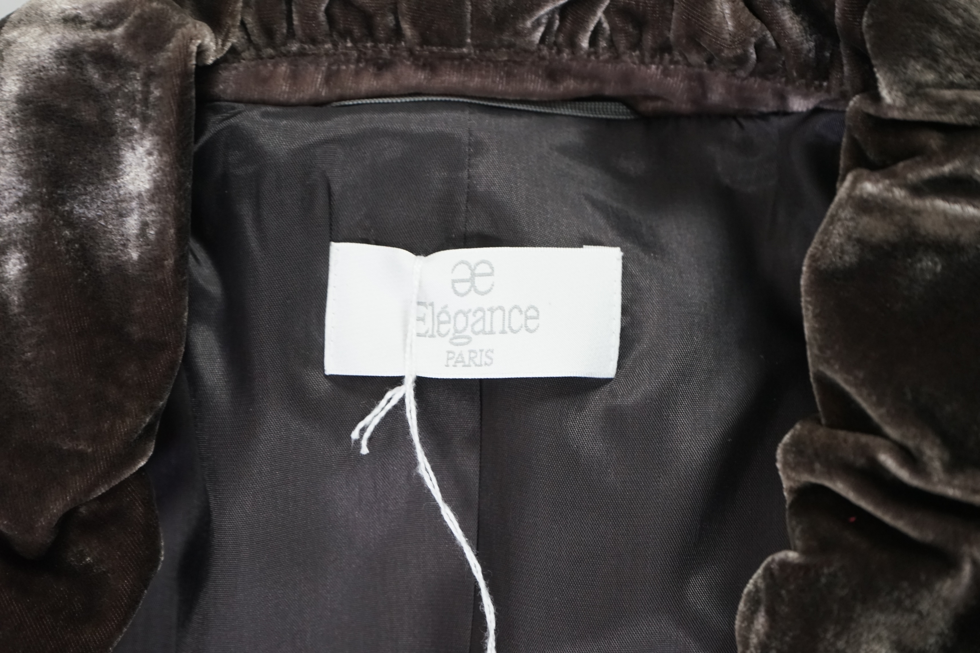 An Elegance lady's trench coat, a velvet jacket and a wool blazer. Approx sizes 14 - 16 Proceeds to Happy Paws Puppy Rescue